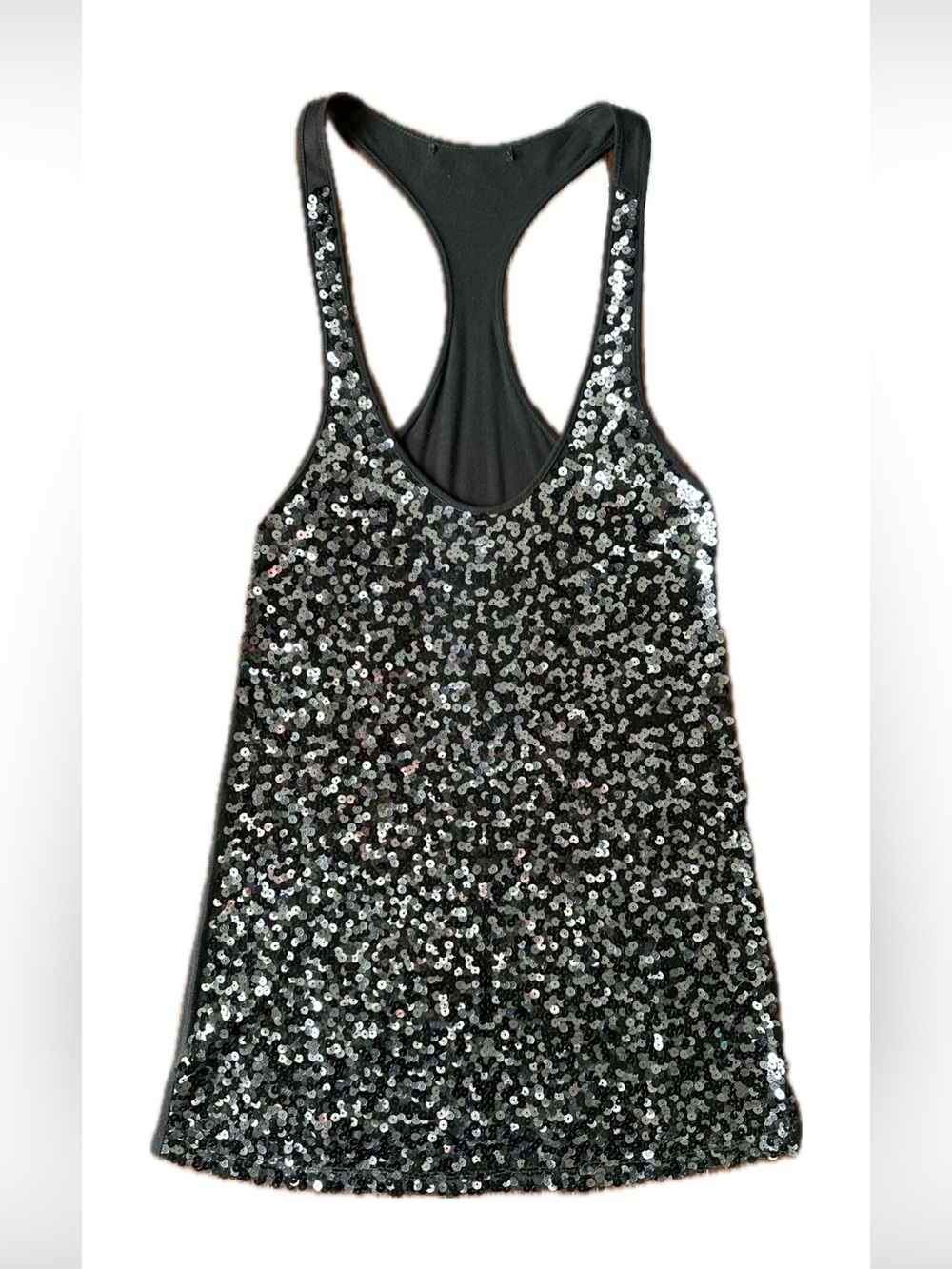 Sleeveless tank top with sparkles; mid long; used.